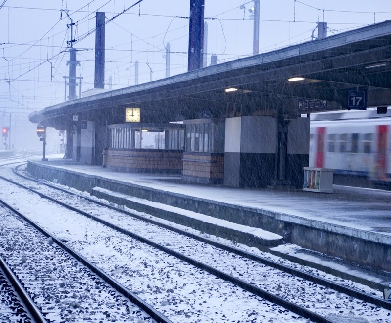 Railway track and platform with snow