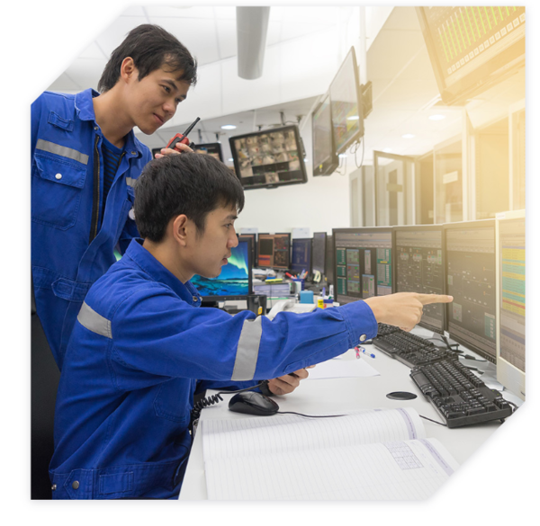 Image shows engineers sat at a SCADA control room