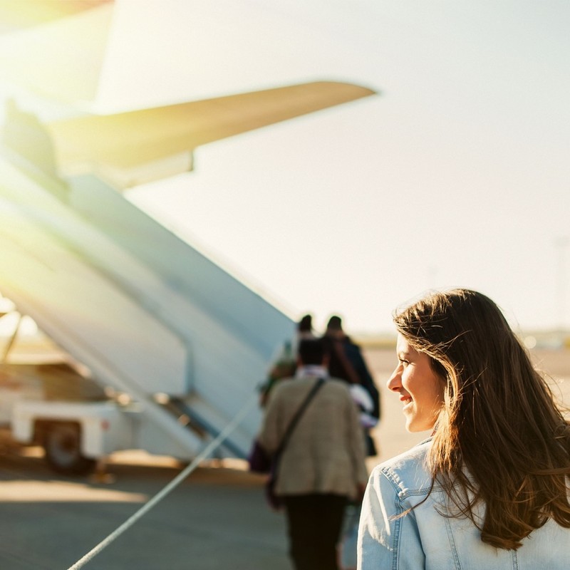 Woman boarding a plane